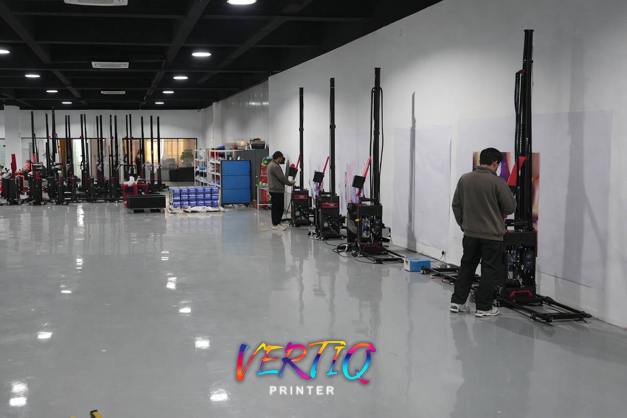Technicians testing Vertiq UV printers